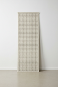 Modern Geometric Runner Rug standing upright against white wall
